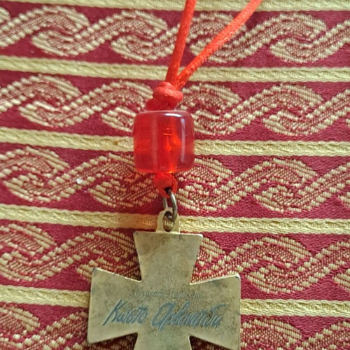 Collectible cross 2012 used with red bead decoration