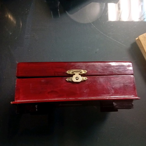 Wooden box used with cork decor under glass