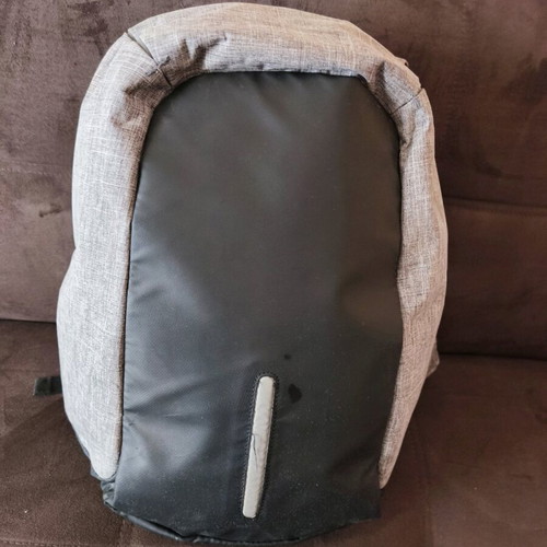NOD anti-theft backpack used, gray with laptop compartment and USB