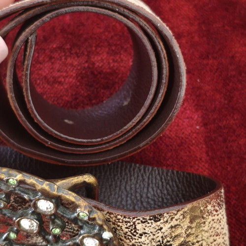Wide gold belt used with decorative buckle and rhinestones
