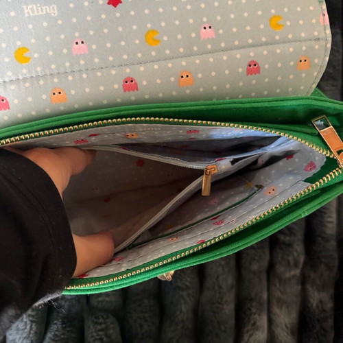 Green suede crossbody bag used with gold details