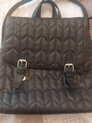Black quilted backpack like new with adjustable straps