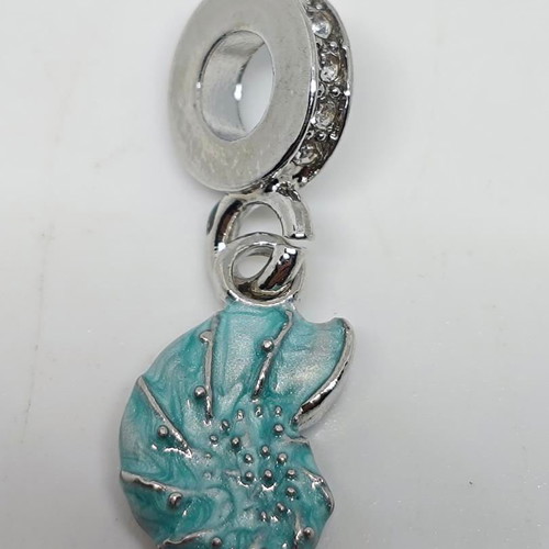 Silver charm with blue enamel Nautilus like new