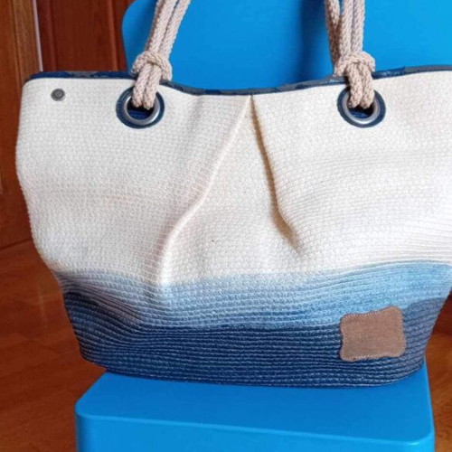 Beach bag used with worn leather