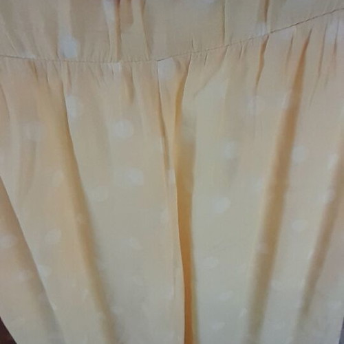 Women's palazzo pants like new, pale yellow with white polka dots