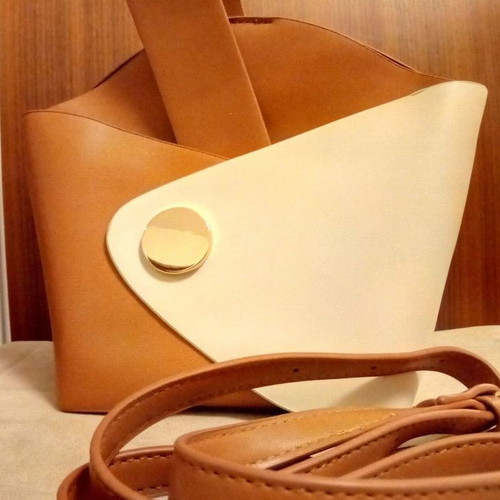 Small bag used with tan and ecru strap