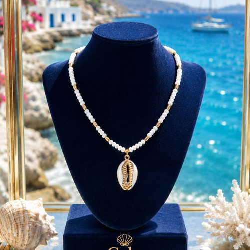 Handmade necklace with white semiprecious stone and natural shell with gold accents