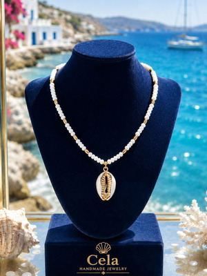 Handmade necklace with white semiprecious stone and natural shell with gold accents
