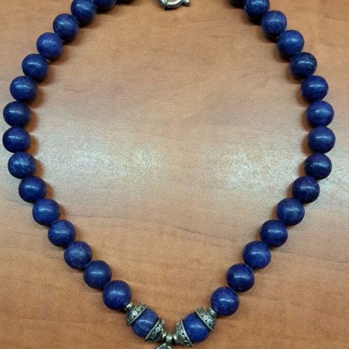Necklace with blue semi-precious stones and silver setting like new