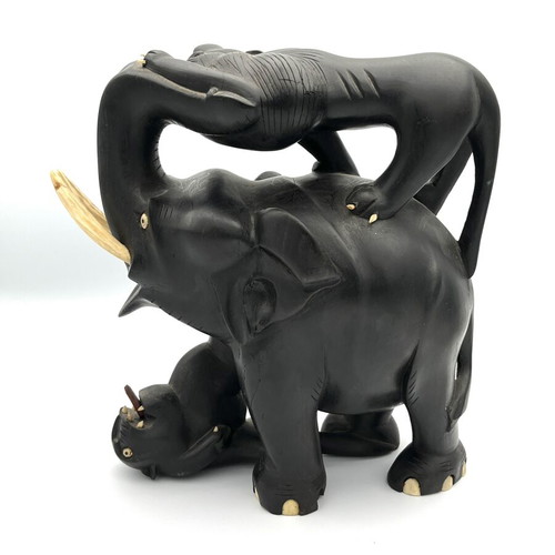 Vintage handmade ebony wood sculpture of elephant and lions