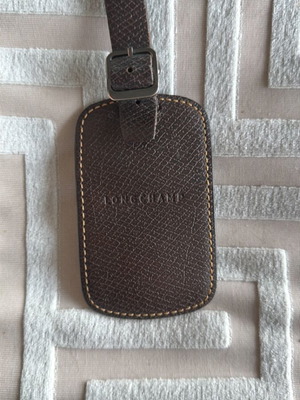 Longchamp leather luggage tag like new, brown