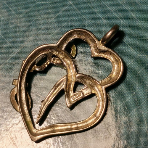 Silver necklace with two hearts and 2010 date used