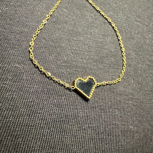 Women's bracelet new in gold tone with black heart