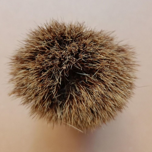 Two shaving brushes, one says it is made in West Germany.