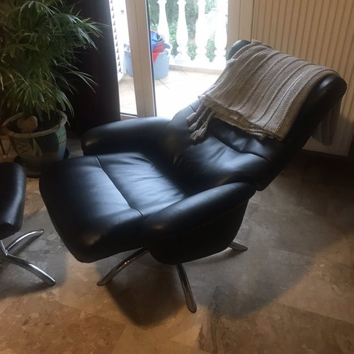 Leather armchair and footstool used, black, with recline