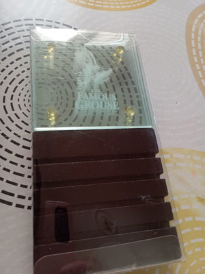 The Famous Grouse collectible glass coaster set with black ribbed base