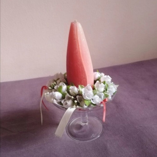 Glass candlestick with wreath and two-tone candle used