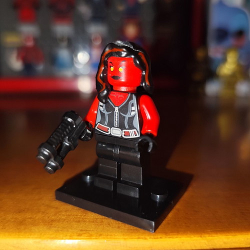 Red She-Hulk figure like new with base, two heads, and gun