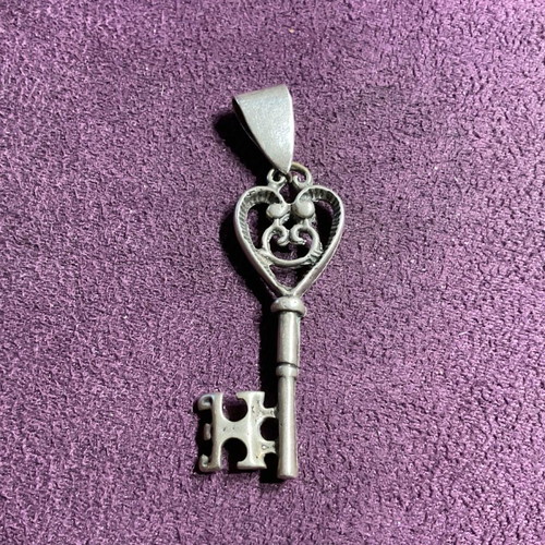 Silver pendant in key shape made of 800 silver