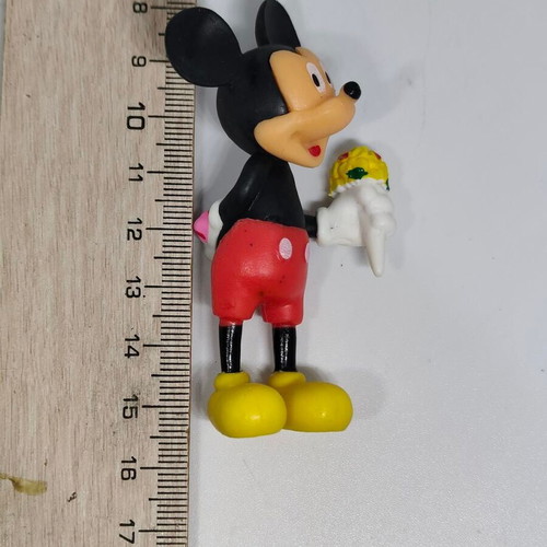 Collectible Mickey Mouse figure like new with bouquet