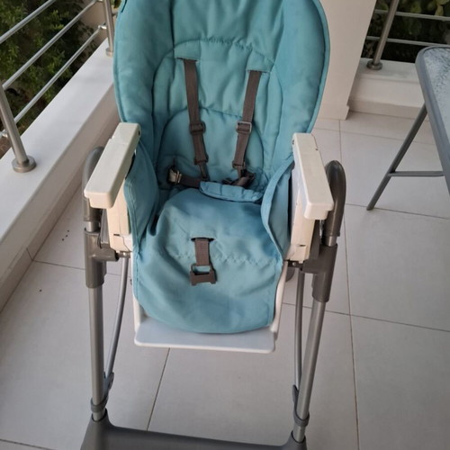 Prenatal high chair used, blue with rear wheels