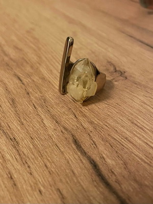 Ring with precious stone used, gold color, yellow stone