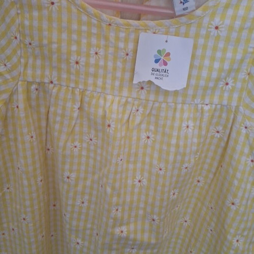 Girls' dress new, size 122 cm, yellow