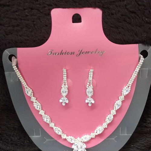 Jewelry set new with silver necklace and earrings with white stones