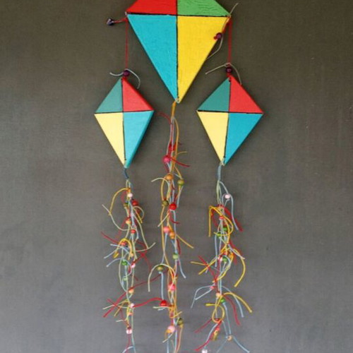 Handmade wooden kites handpainted with beads