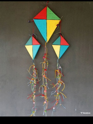 Handmade wooden kites handpainted with beads