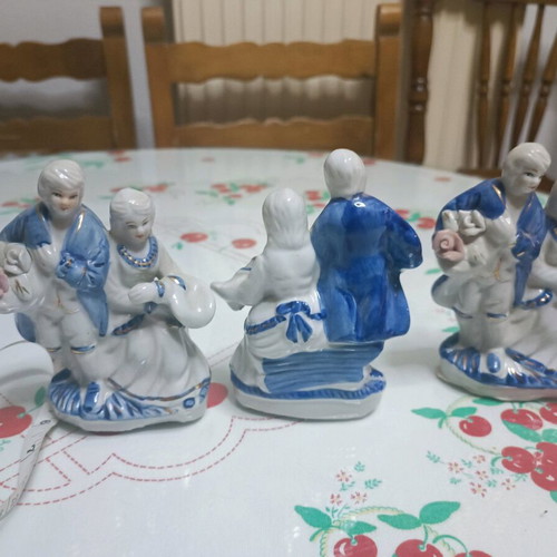 Porcelain figurines like new, pair with pink, blue, and gold flowers