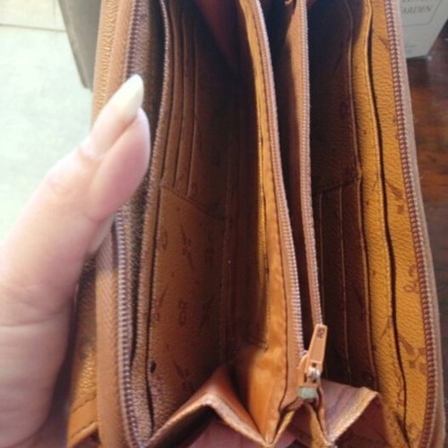 Wallet used camel color with many pockets and minor defect