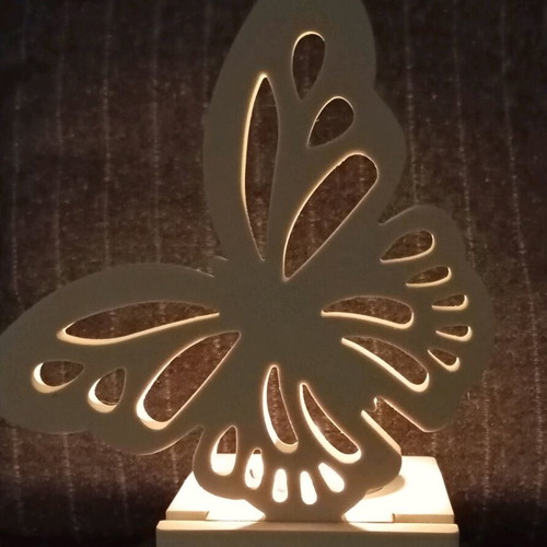 Decorative candle holder with butterfly design in white porcelain powder