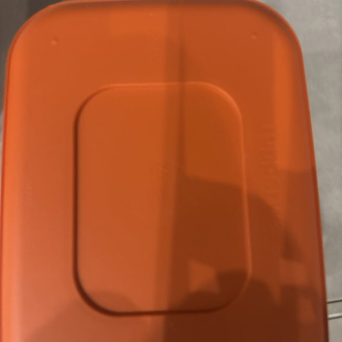 Tupperware canister with figures