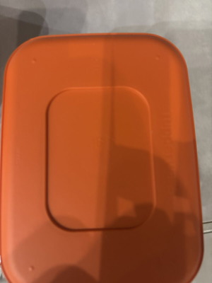 Tupperware canister with figures