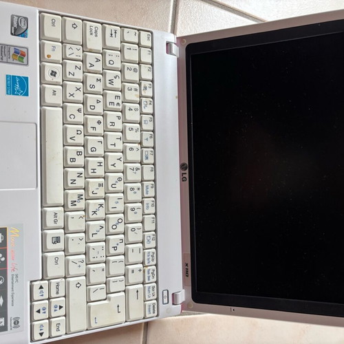 LG laptop like new without charger with pink cover and scratches