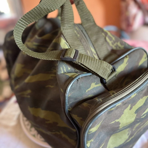 Military camouflage bag with straps used