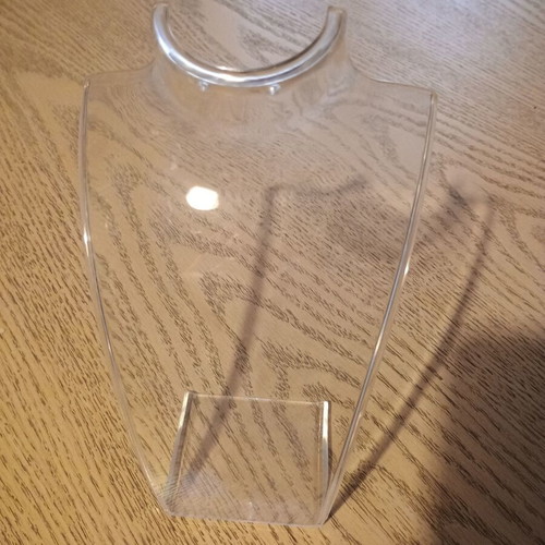 Jewelry stands used, one large transparent and one small matte