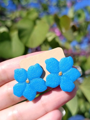 Handmade blue earrings made of polymer clay and steel