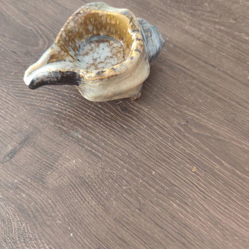 Ceramic ashtray in shell shape used