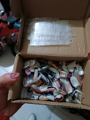 Nail set used with fake nails, stickers, and stamper
