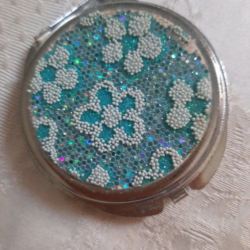 Compact mirror used small for bag with regular and magnifying mirror