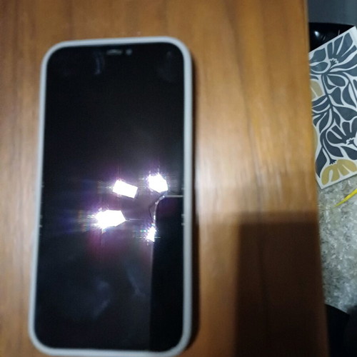Apple iPhone 12 64GB like new with cracked back and 3 cases
