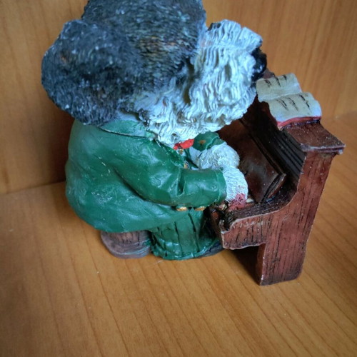 Decorative dog figure with piano like new