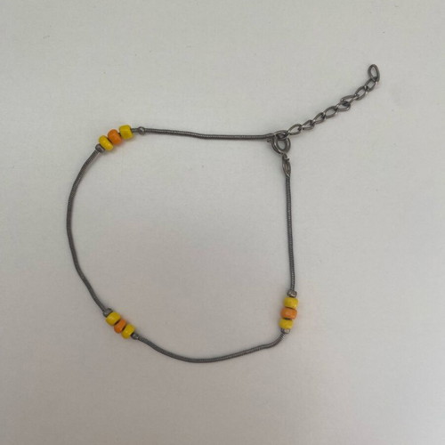 Silver bracelet used with orange and yellow beads