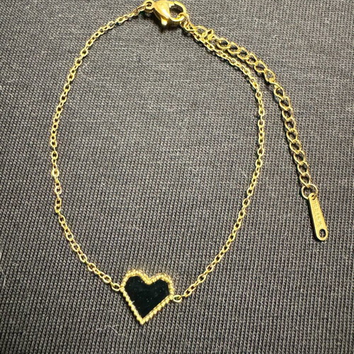 Women's bracelet new in gold tone with black heart
