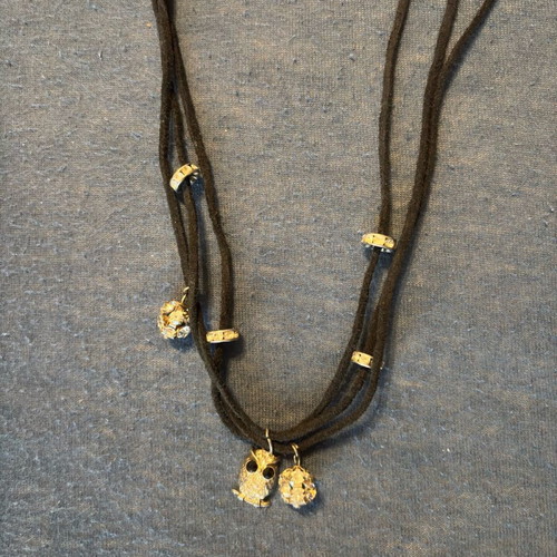 Necklace with cords and gold charms like new stainless steel