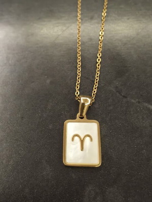 Necklace made of stainless steel like new, gold color with white Aries zodiac