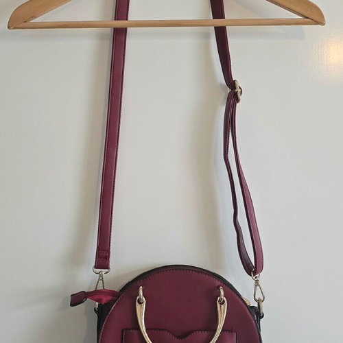Round red shoulder bag