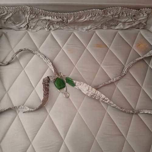 Vintage suitcase used with dark green color and quilted lining